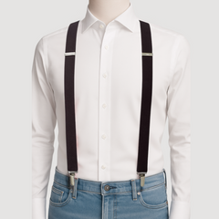 White shirt with black suspenders and blue jeans on a mannequin against a white background
